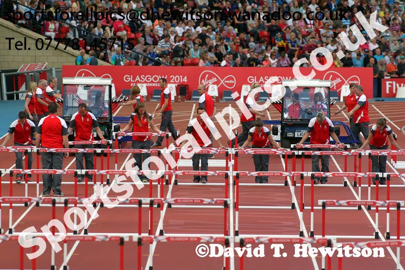 Puttng out the hurdles at the Commonwealth Games, Glasgow. Photo: David T. Hewitson/Sports for All Pics